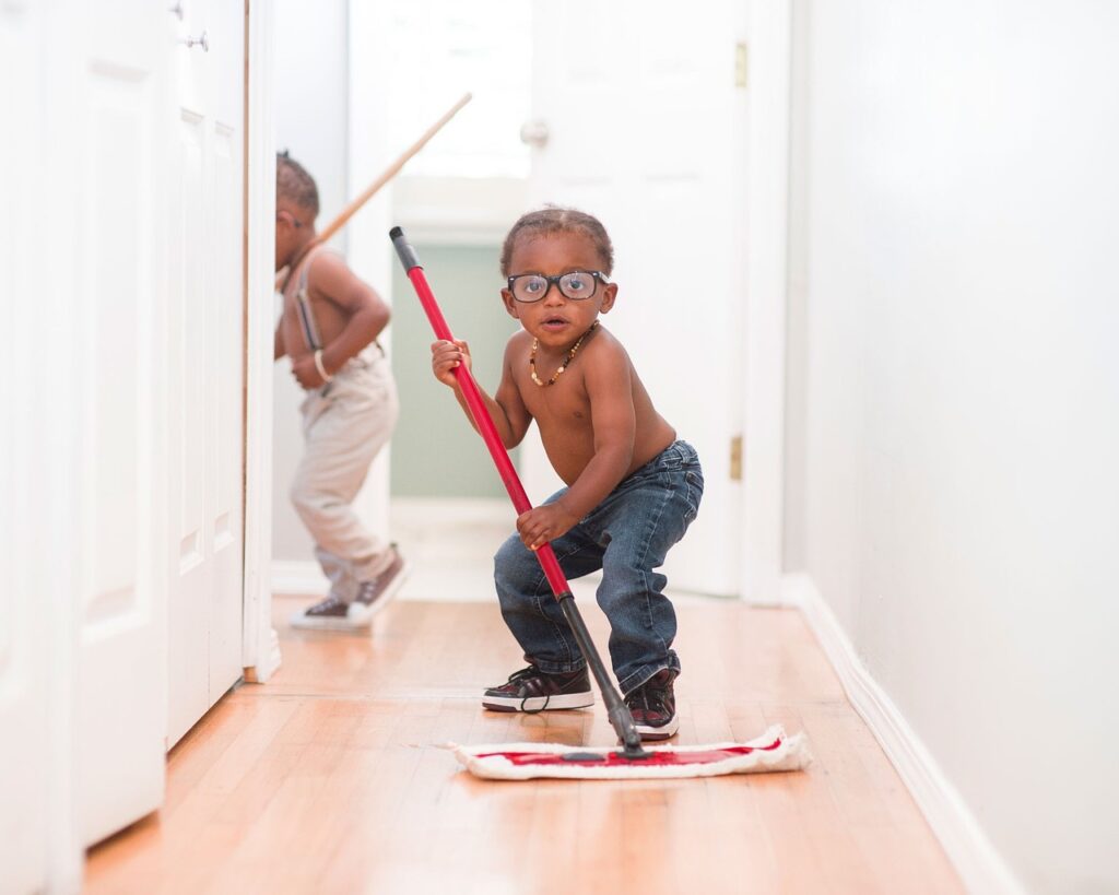 Child is mopping the floor